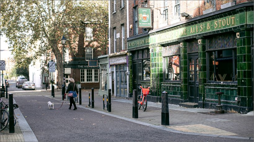 Green pub shopfront in London. Cow & Co estate agency London