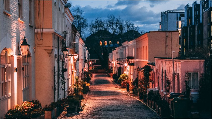 Old walkway in London at night. Cow & Co estate agency in London