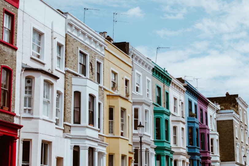 Old apartments in London painted with beautiful colors. Cow & Co estate agency in London